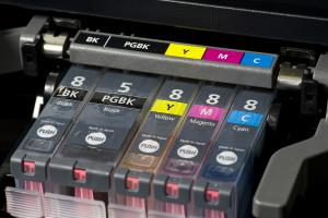 close-up shot of a CMYK ink cartridges for a color printer shallow depth of field